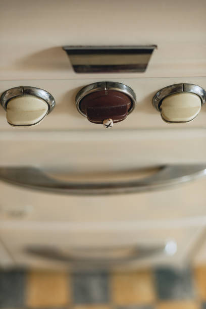 Control knobs of an old gas stove.