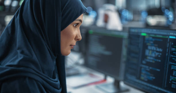 istock Portrait of a Smart Focused Middle Eastern Engineer Working on Computer in a Technological Corporate Office. Young Arab Woman in Hijab Developing Software for an Innovative Internet Service Provider 1522060168
