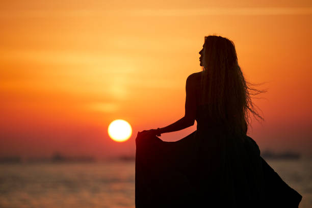lady with long hair standing with a night dress near seaside, istanbul