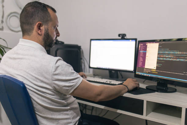 istock Male programmer working at home in his home office 1522084826