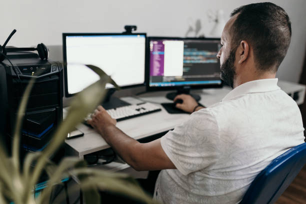 istock Male programmer working at home in his home office 1522088991