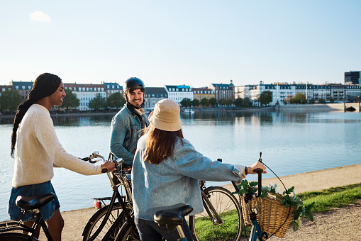 Young adult friends out sightseeing around Copenhagen by bike.