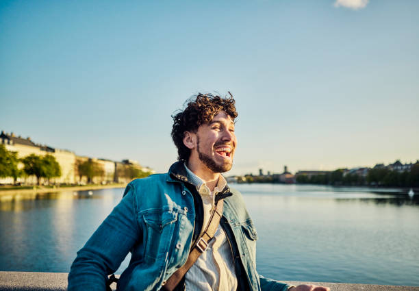Young man smiling on his daily commute in the city of Copenhagen. stock photo