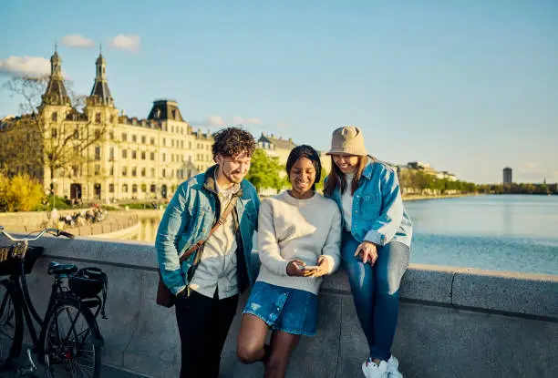 Photo of Better together: Group of multi-ethnic friends enjoying their time in the city of Copenhagen