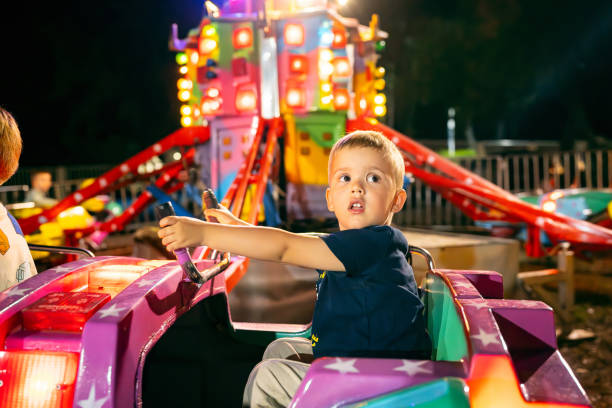 istock Boy having fun in an amusement park 1522158059