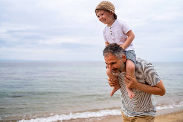 istock Father and son on the beach 1522164158