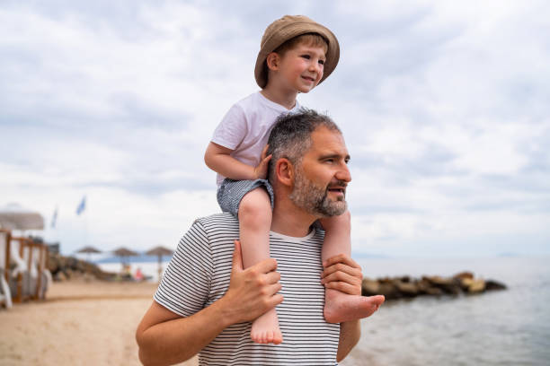 istock Father and son on the beach 1522165202