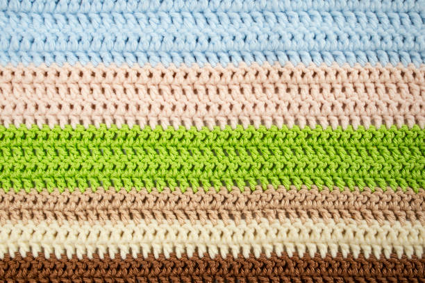 horizontal colored crochet lines pattern, beige, blue, green and brown colors, horizontal rows  close up background