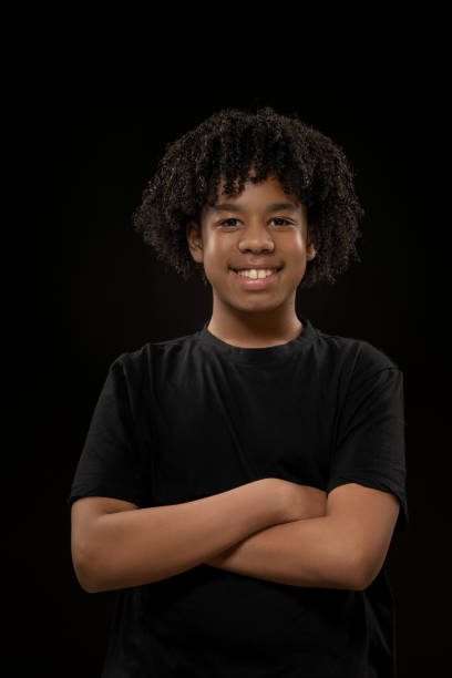 istock Handsome young black teenage boy posing for studio portrait 1522180641