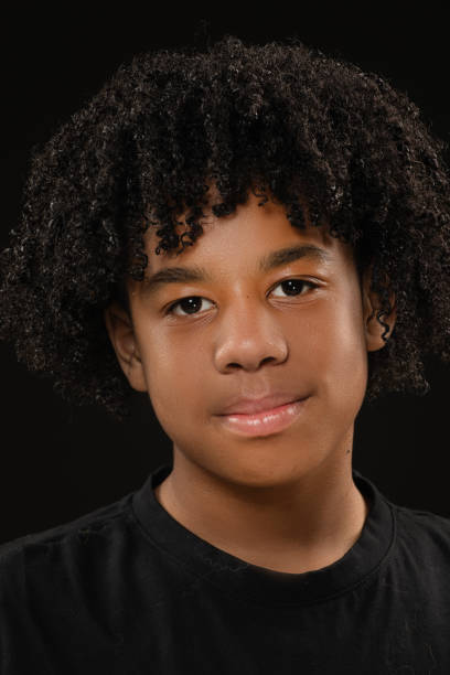 istock Handsome young black teenage boy posing for studio portrait 1522180878