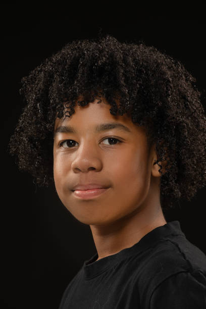 istock Handsome young black teenage boy posing for studio portrait 1522181183