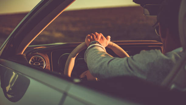 istock Summer Road Trip Behind a Convertible Car Wheel 1522197784