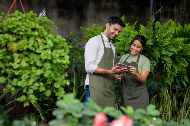 istock Happy employees working at a garden center using a digital tablet 1522207965