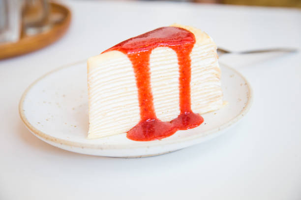 istock Home made crepe cake on white disk with strawberry cream 1522211204
