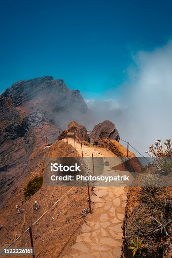istock Hiking trail through the mountains to Madeiras highest peak Pico Ruivo 1861 meters above sea level. On the island Madeira, Portugal. 1522226161
