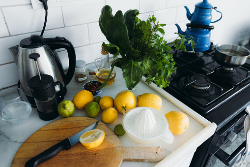 High-angle view of lemons and limes in bright authentic blue Turkish kitchen