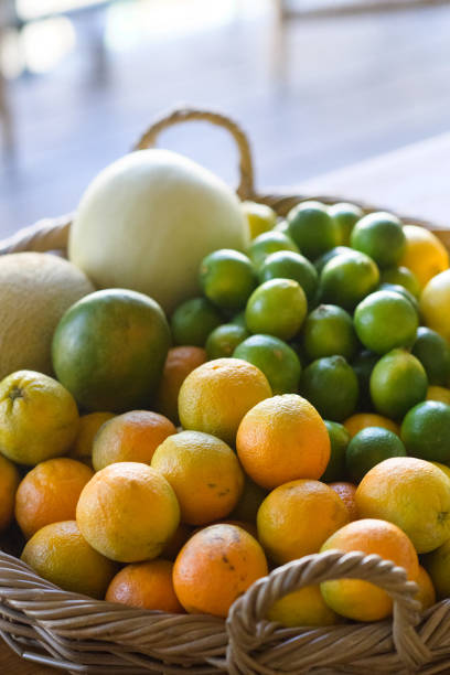 istock Colourful tropical Basket with lemons oranges melons and mangos 1522236808