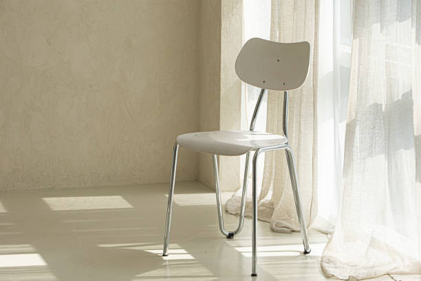 istock Modern white chair in beige room interior 1522268596