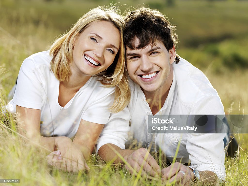 happy beautiful couple on nature portrait of young happy beautiful couple on nature Adult Stock Photo