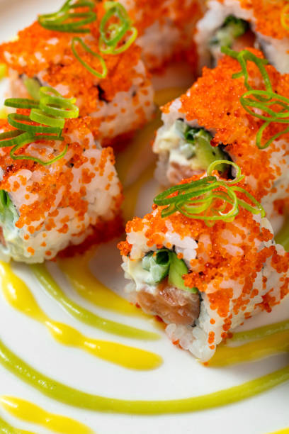 Tobiko roll stuffed with salmon