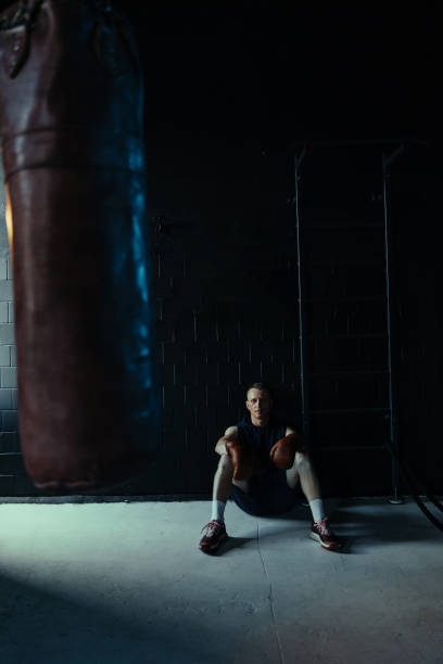 istock Tired boxer resting in gym after exercising. 1522282691