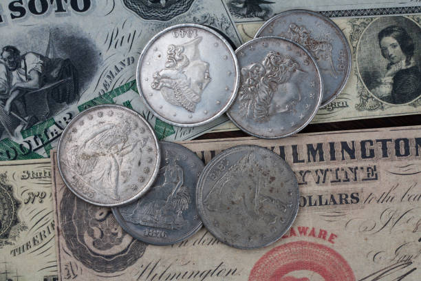 istock Old west US banknotes and silver certificates with silver dollar coins 1522287965