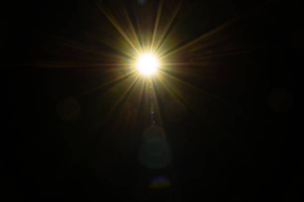 istock Blurred image Sun flare on the black background 1522325137