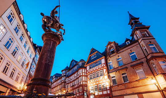 fountain with statue at the historic market square in Marburg, Germany