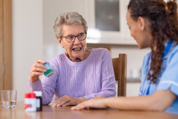 istock Discussing Medication with Home Nurse 1522334522