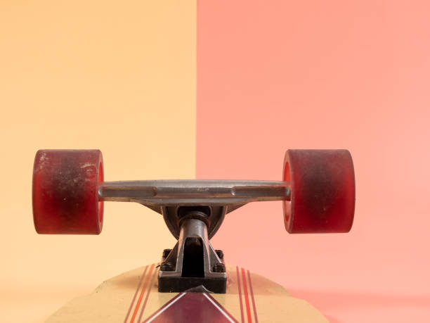 istock Skateboard on a pink and orange background. 1522341236