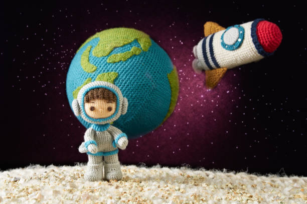 istock mall and cute Amigurumi doll .　astronaut in outer space 1522343008