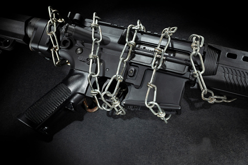 Assault rifles bound in chains due to gun control legislation