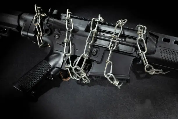 Assault rifles bound in chains due to gun control legislation