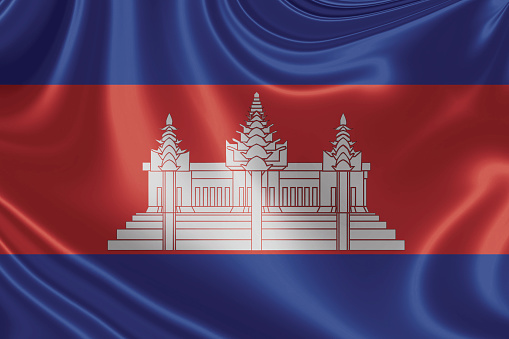 Grunge map of Cambodia with its flag printed within its border on an old paper.