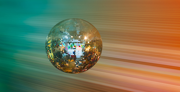 Party disco mirror ball reflecting green lights