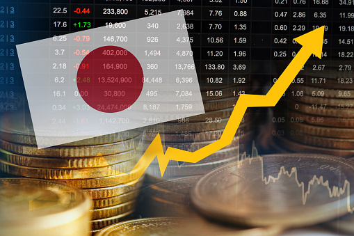 Japan flag with stock market finance, economy trend graph digital technology.