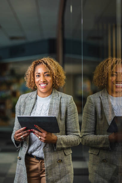 istock Smiling Mature Hispanic Female Financial Advisor Using A Digital Tablet At Work 1522377633