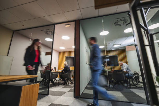 istock Corporate Employees Walking And Working At The Office At Night 1522378559