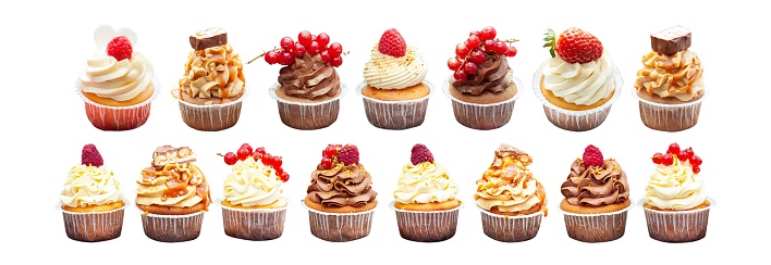 Set of 15 different cupcakes with chocolate, vanilla and salted caramel, fresh berries and peanuts isolated on white background, png