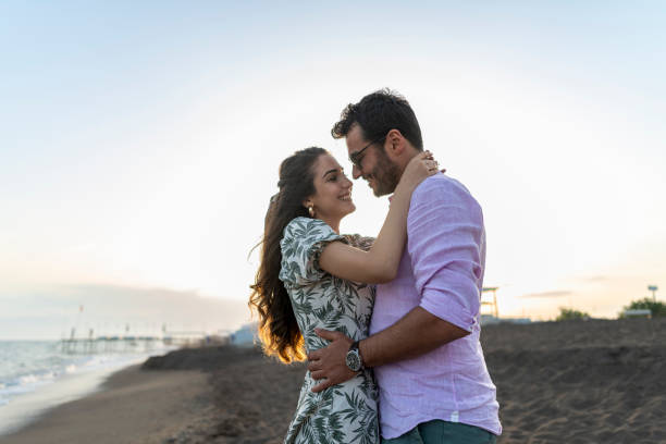 istock Romantic couple in love cuddling outdoors during sunset. 1522394380