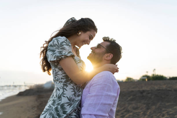 istock Romantic couple in love cuddling outdoors during sunset. 1522395460