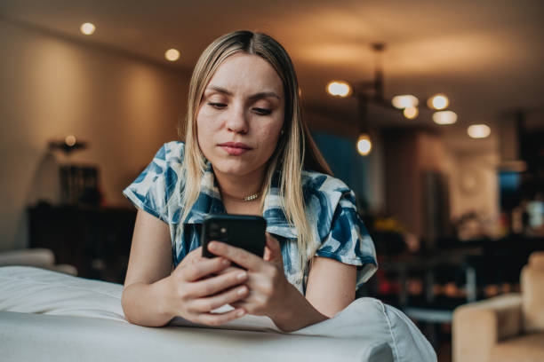 istock Woman at home using smartphone 1522421715