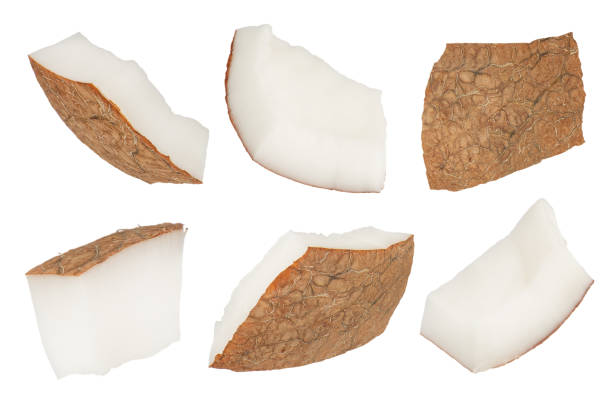 istock Slices of coconuts on a white isolated background. Different sides of coconut slices with a crust close-up. Coconut slices isolate. 1522481132