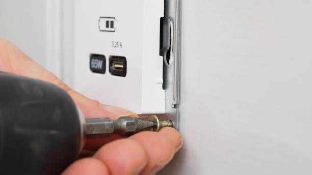 istock Installation of a USB Type-C socket at the head of the bed for charging devices. 1522483428