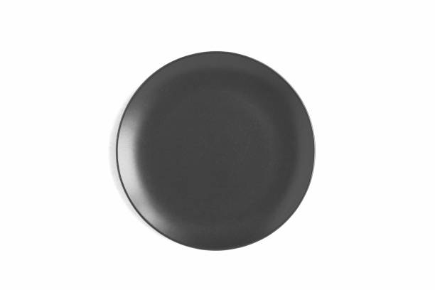 istock Empty black plate on the white background. Top view. Close-up. 1522493992