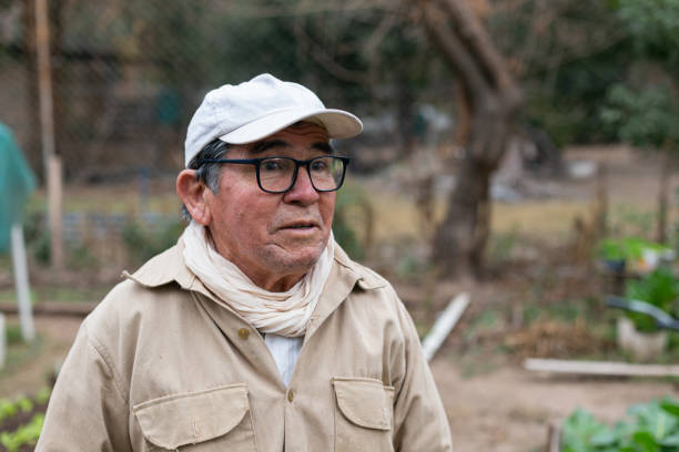 istock man in his 70's showing his vegetable garden in winter 1522511086