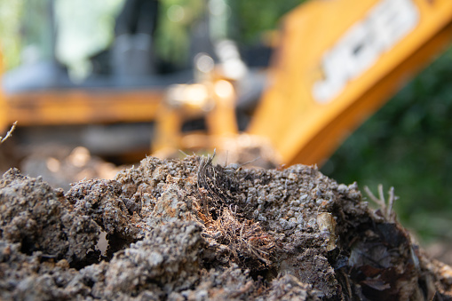 blurred image of excavator on the ground