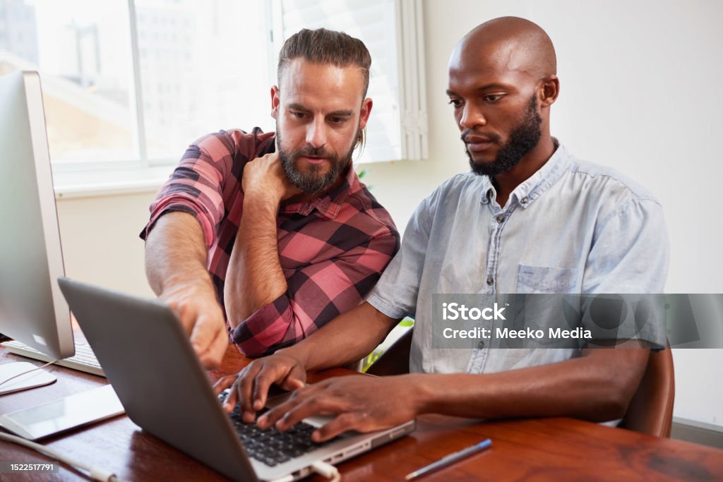 Two Developers Peer Programming Together In Office Coding Side By Side ...