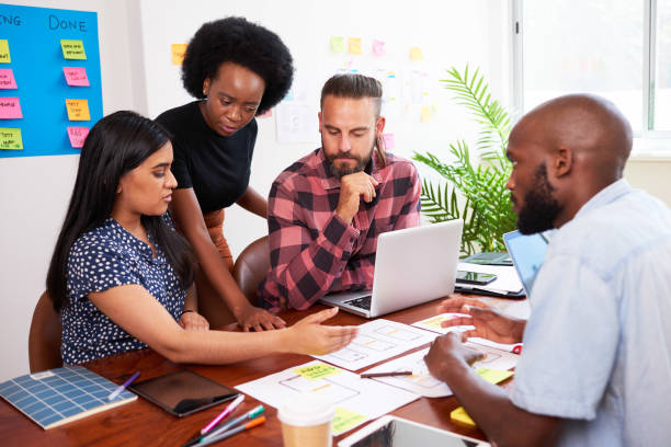 istock Serious team of developers brainstorming new app idea in boardroom meeting 1522524506
