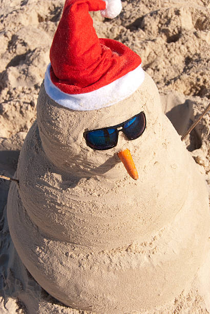 istock Sand Build Snowman With Sunglasses 152253624